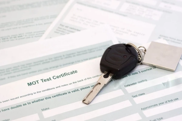 MOT-test-certificate-with-car-key-What-Causes-MOT-Failure