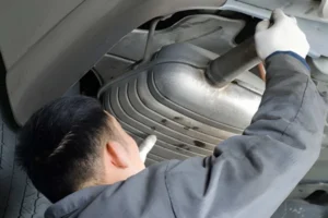 auto-mechanic-removing-catalytic-converter