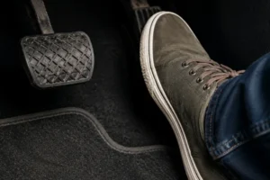 burning-rubber-smell-in-your-car-caused-by-possible-clutch-problems-as-a-driver-presses-the-pedal-inside-the-vehicle