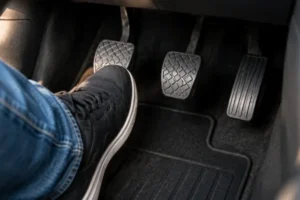 Drivers-foot-on-the-clutch-pedal-which-can-contribute-to-a-Worn-Out-Clutch
